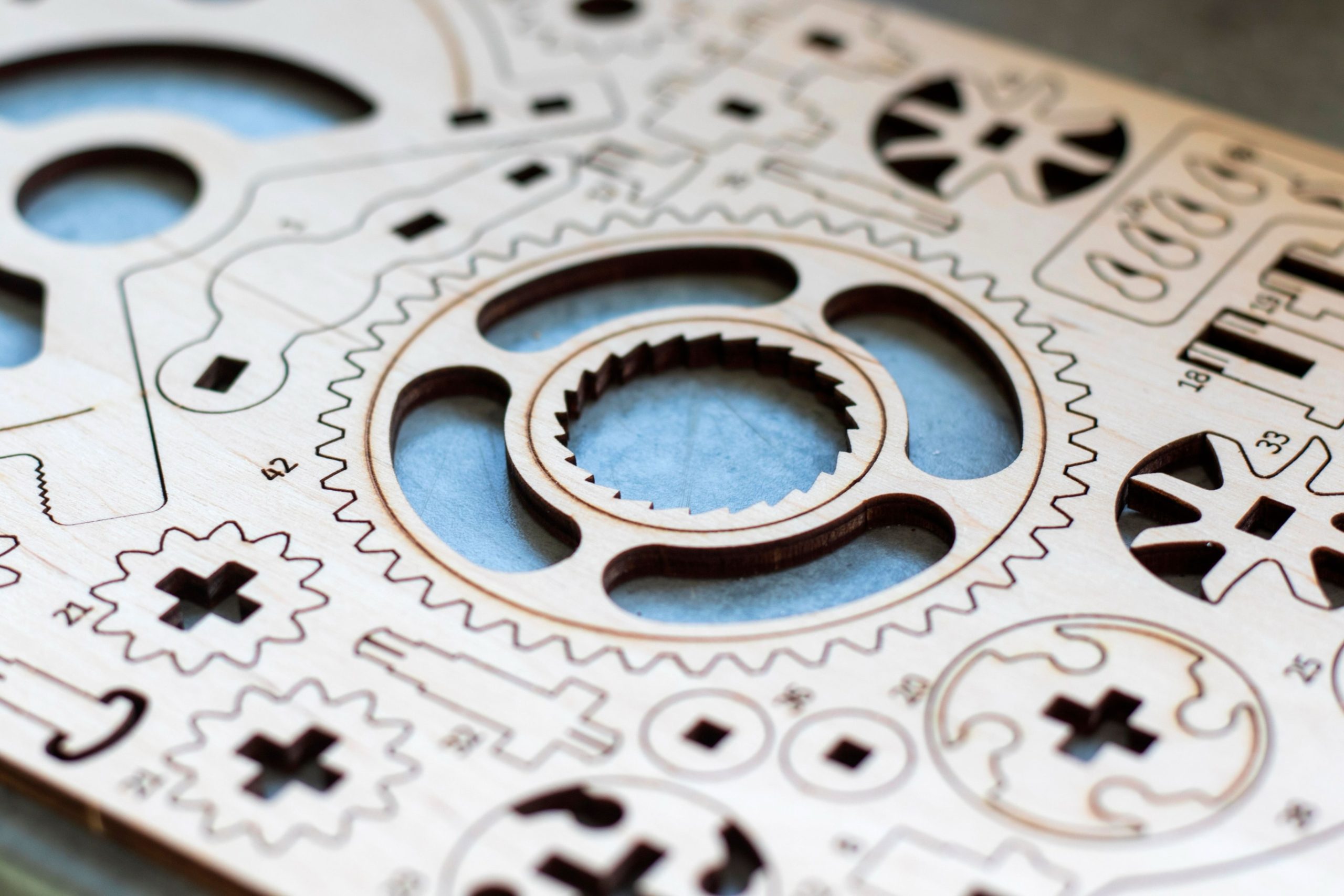 CO2 laser cut wood pieces with engraved designs